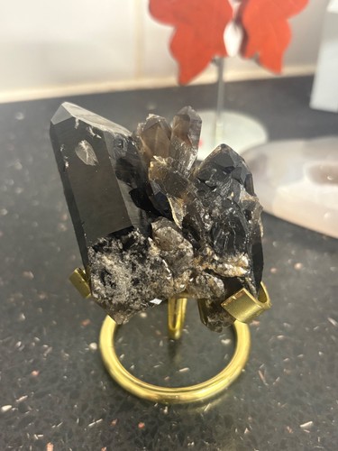 Smoky quartz cluster stand - on,